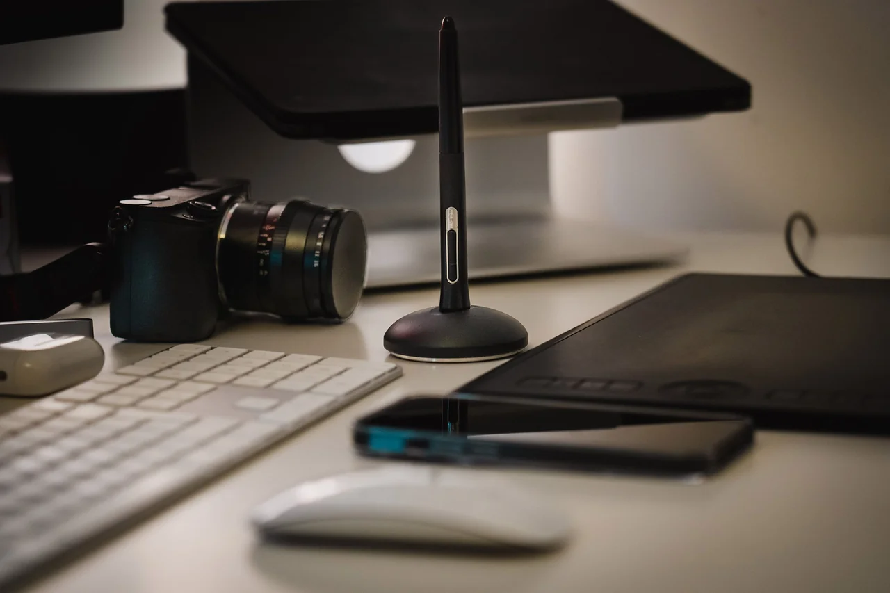 Clean architectural drawing tablet and digital tools on wooden desk